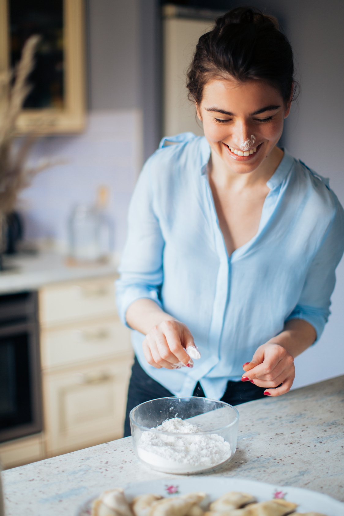 Woman In Blue Long Sleeve Top With Flour On Her Nose